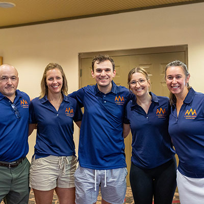 A Week Away volunteers lined up wearing AWA polos.