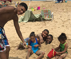 A family on respite at the beach sponsored by A Week Away.