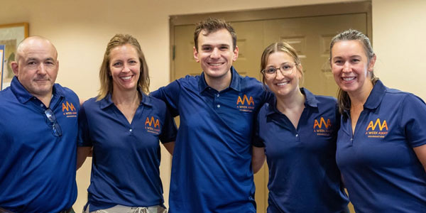 A Week Away team wearing AWA polos.